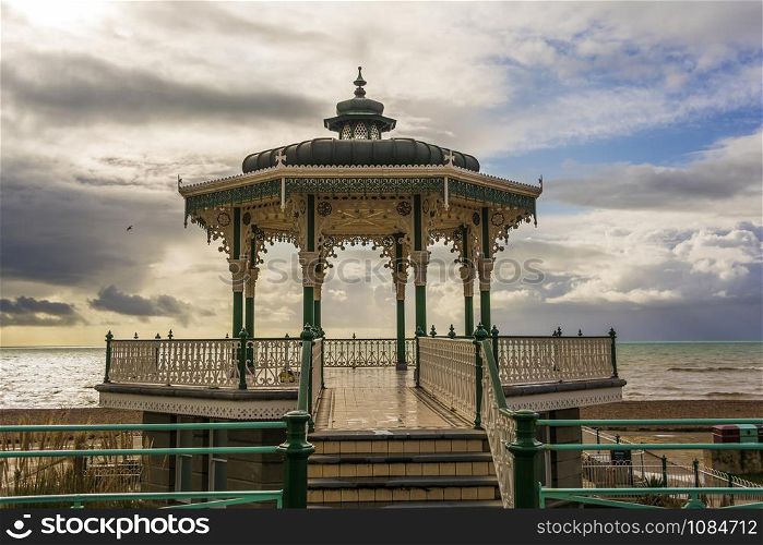 The Victorian bandstand near the beach in Brighton, UK.. The Victorian bandstand near the beach in Brighton