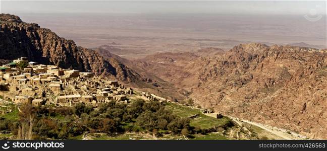 The village of Dana on the edge of the Dana Reserve, a deep valley cut in the south-western mountainous region of the Kingdom of Jordan, panoramic view, middle east