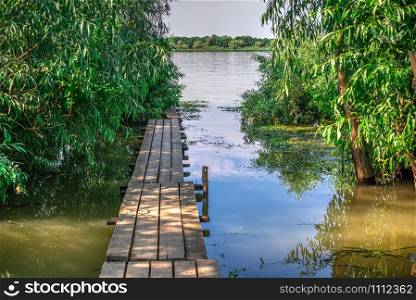 The village of Vilkovo in Odessa region, Ukraine. The beginning of the river walk to the Danube Delta. Village Vilkovo in Odessa region, Ukraine