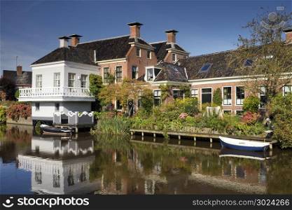 The village Onderdendam. The village Onderdendam on the Boterdiep canal in the Dutch province Groningen
