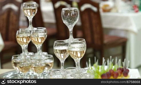 The waiter serving champagne at the reception