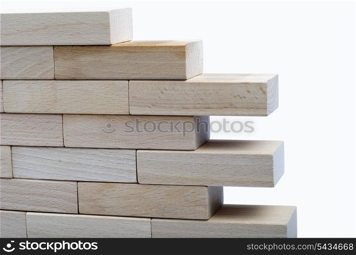 The wall from wooden bricks isolated on white background with clipping path