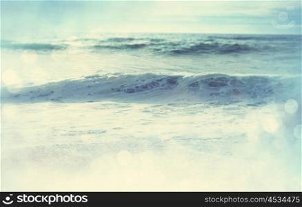 The wave on the beach. Blur background and sunny light. Peaceful nature background.