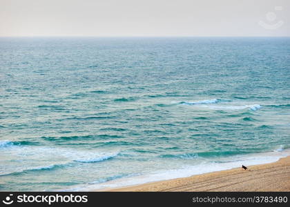 The waves of the Mediterranean Sea in the setting sun