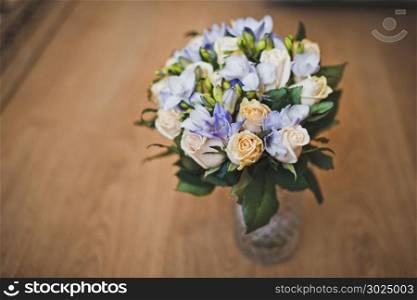 The wedding bunch of flowers lies in a vase on a table.. Bunch of flowers 1408.