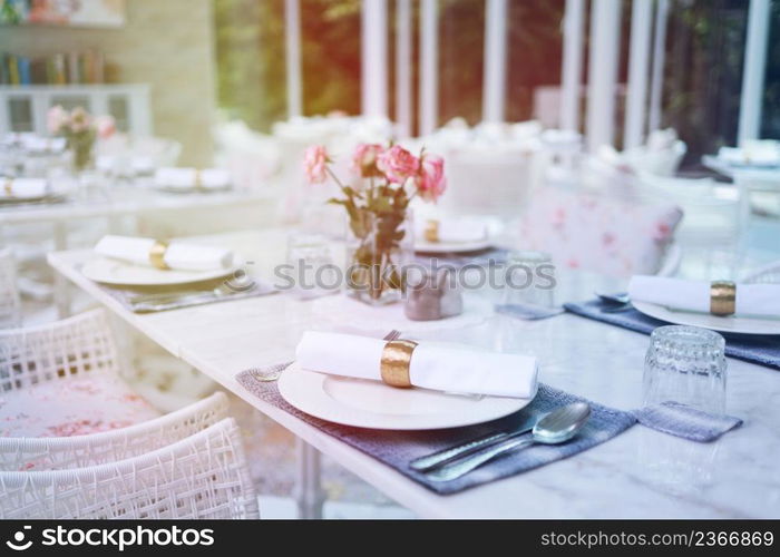 The wedding decor. Tables set for an event party or wedding reception. luxury elegant table setting dinner in a restaurant. glasses and dishes. hall for banquets and weddings