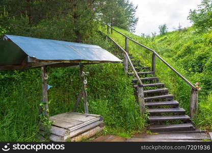 The well at the Holy spring in honor of the icon mother of God Joy of All who sorrow Sharinsky district, Kostroma region, Russia.