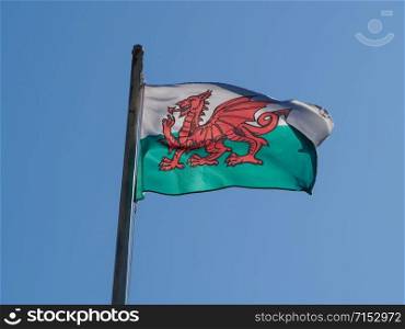 the Welsh national flag of Wales, UK over blue sky. Welsh Flag of Wales over blue sky