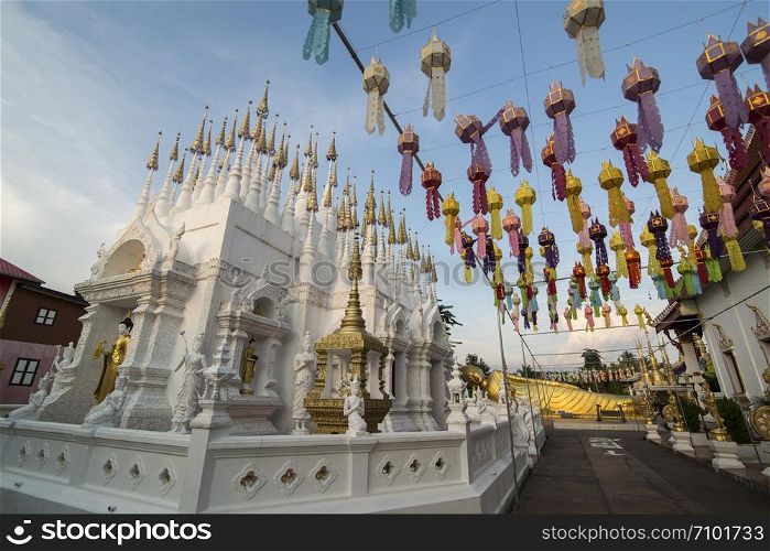 the white and golden Stupas and chedi at a rood of a temple at Wat Pong Sunan Temple in the city of Phrae in the north of Thailand. Thailand, Phrae November, 2018.. THAILAND PHRAE WAT PONG SUNAN TEMPLE