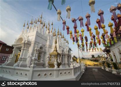 the white and golden Stupas and chedi at a rood of a temple at Wat Pong Sunan Temple in the city of Phrae in the north of Thailand. Thailand, Phrae November, 2018.. THAILAND PHRAE WAT PONG SUNAN TEMPLE