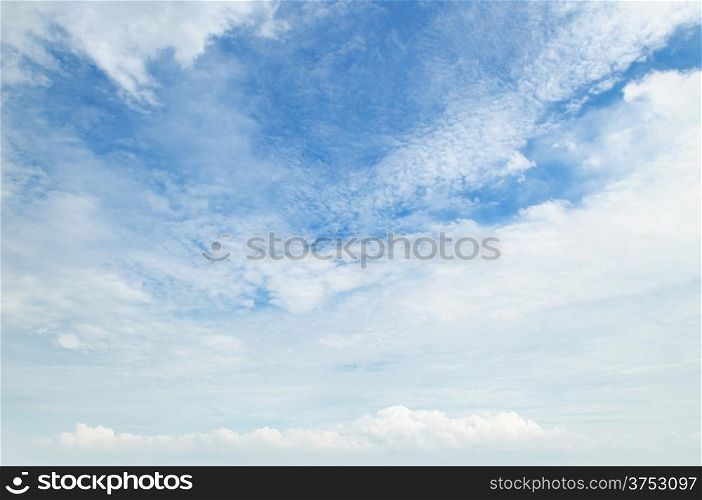 The white cumulus clouds against the blue sky