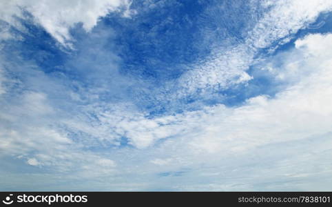 The white cumulus clouds against the blue sky