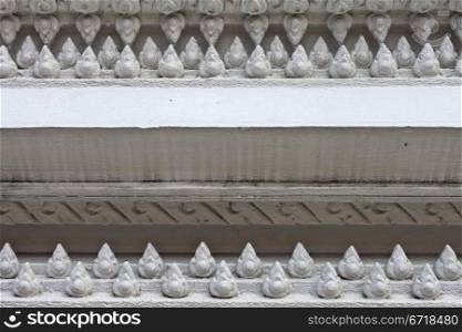 The White stucco , thai style on the Wall