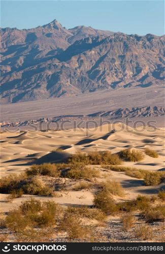 The wind piles up sand on the valley floor