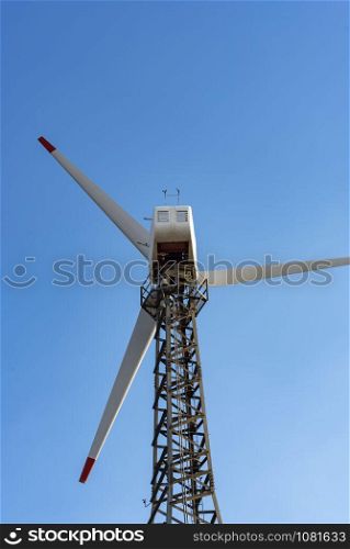 The wind turbine power working, blue sky, energy power concept