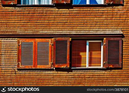 The Window on the Facade of Wooden House in Switzerland