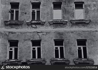 The windows of the old dilapidated city buildings