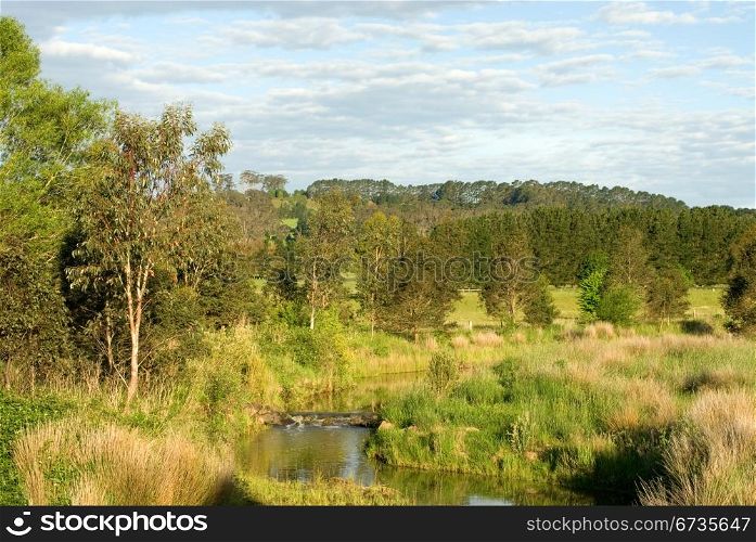 The Wingecarribee River, flowing through famland near Bowral, New South Wales, Australia
