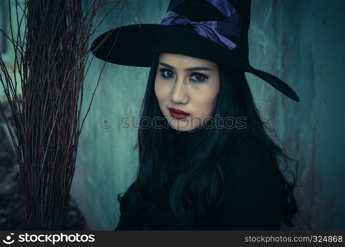 The witch and broomstick on dark background, Halloween day concept