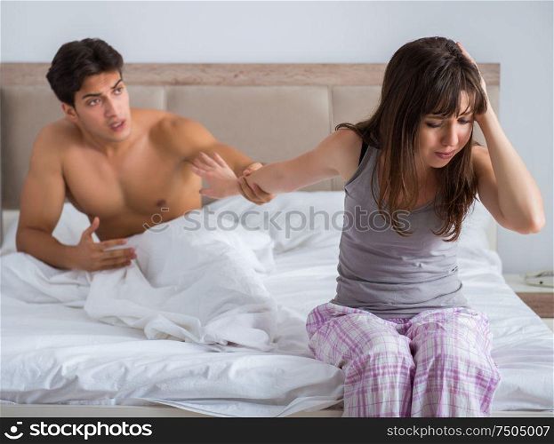 The woman and man in the bedroom. Woman and man in the bedroom
