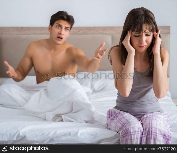 The woman and man in the bedroom. Woman and man in the bedroom