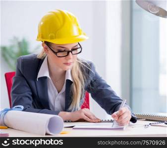 The woman architect working on the project. Woman architect working on the project