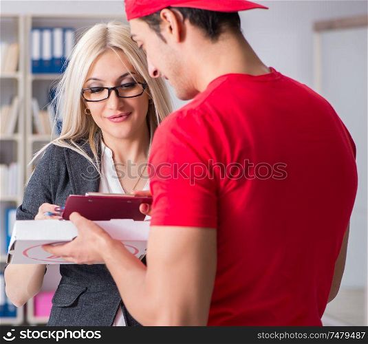 The woman businesswoman receiving mail parcel from courier. Woman businesswoman receiving mail parcel from courier
