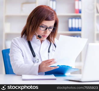 The woman doctor in telemedicine concept. Woman doctor in telemedicine concept