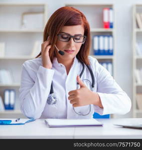 The woman doctor in telemedicine concept. Woman doctor in telemedicine concept