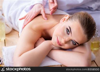 The woman during massage session in spa. Woman during massage session in spa