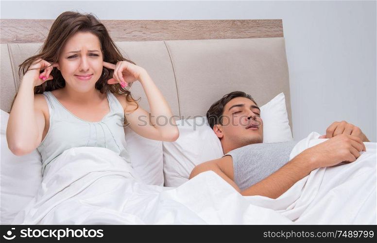 The woman having trouble with husband snoring. Woman having trouble with husband snoring