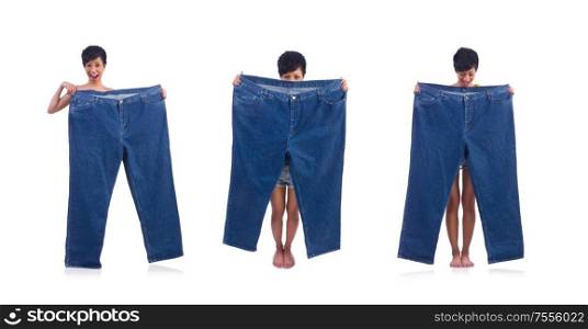 The woman in dieting concept with big jeans. Woman in dieting concept with big jeans