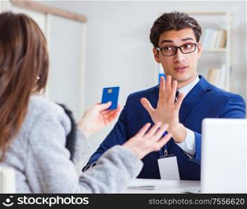The woman makes payment with credit card. Woman makes payment with credit card