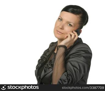 The woman talks by a mobile phone. It is isolated on a white background.