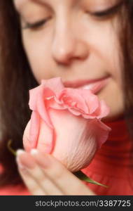 The woman with a rose. A photo close up parts of the person and a flower