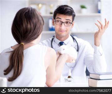 The woman with pet rabbit visiting vet doctor. Woman with pet rabbit visiting vet doctor