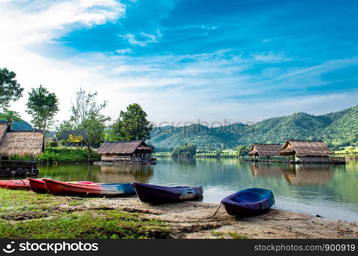 The wooden raft and Kayak in the water reservoirs and mountain views.