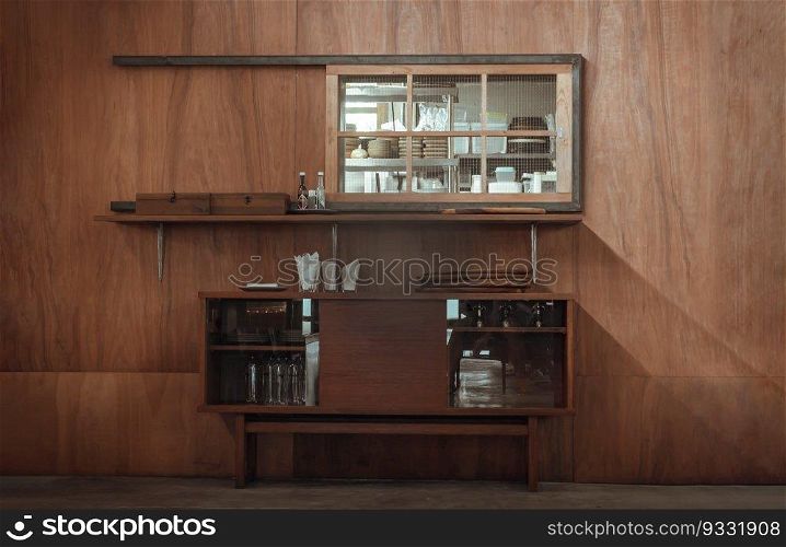 The Wooden Vintage Cabinet for Storing Dishes is placed in front of the Wooden Wall, which is outside of the Kitchen Counter. The Japanese Minimalist Restaurant Interior Design. Selective focus.