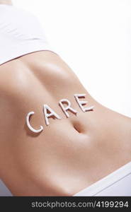 The word &acute;care&acute; in the abdomen of a young girl