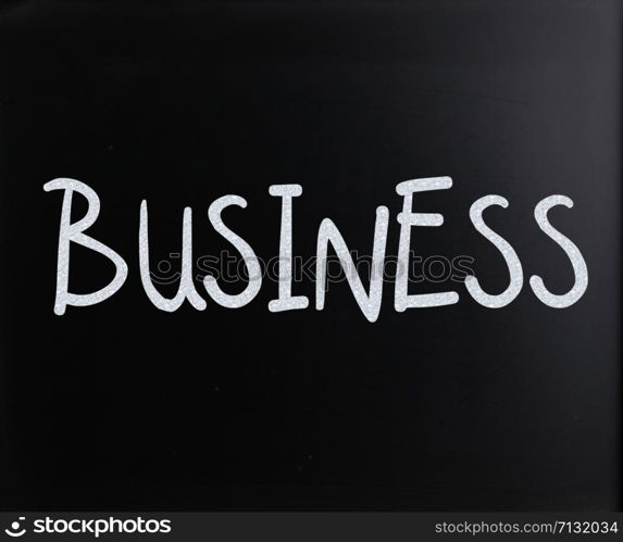 "The word "Business" handwritten with white chalk on a blackboard"