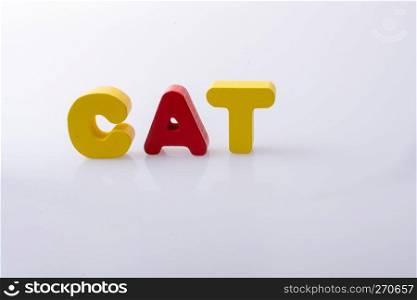 the word CAT written with colorful letter blocks