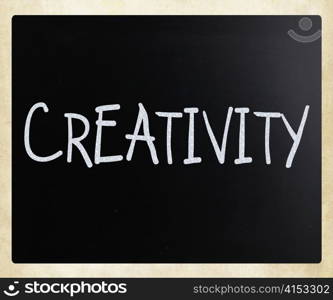 "The word "Creativity" handwritten with white chalk on a blackboard"