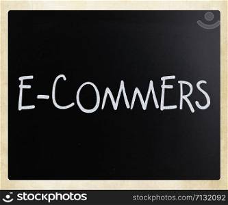 "The word "E-commers" handwritten with white chalk on a blackboard"
