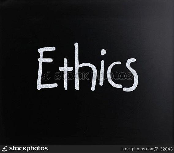 "The word "Ethics" handwritten with white chalk on a blackboard"