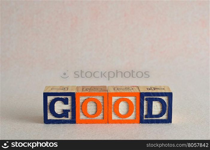 The word good spelled with colorful blocks isolated on a white background