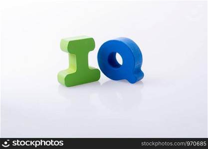 the word IQ written with colorful letter blocks