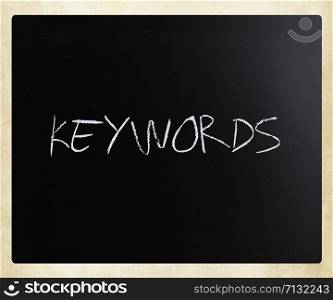 "The word "Keywords" handwritten with white chalk on a blackboard."