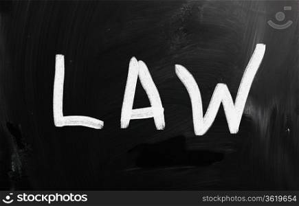 "The word "Law" handwritten with white chalk on a blackboard"