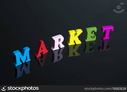 The word market of colored letters on black background.. The word market on the black background.