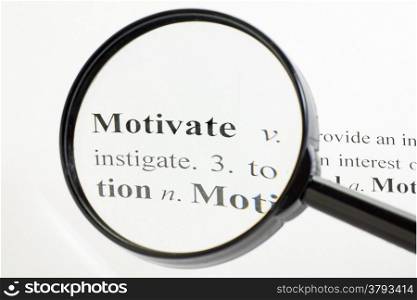 The word motivate seen through a magnifying glass